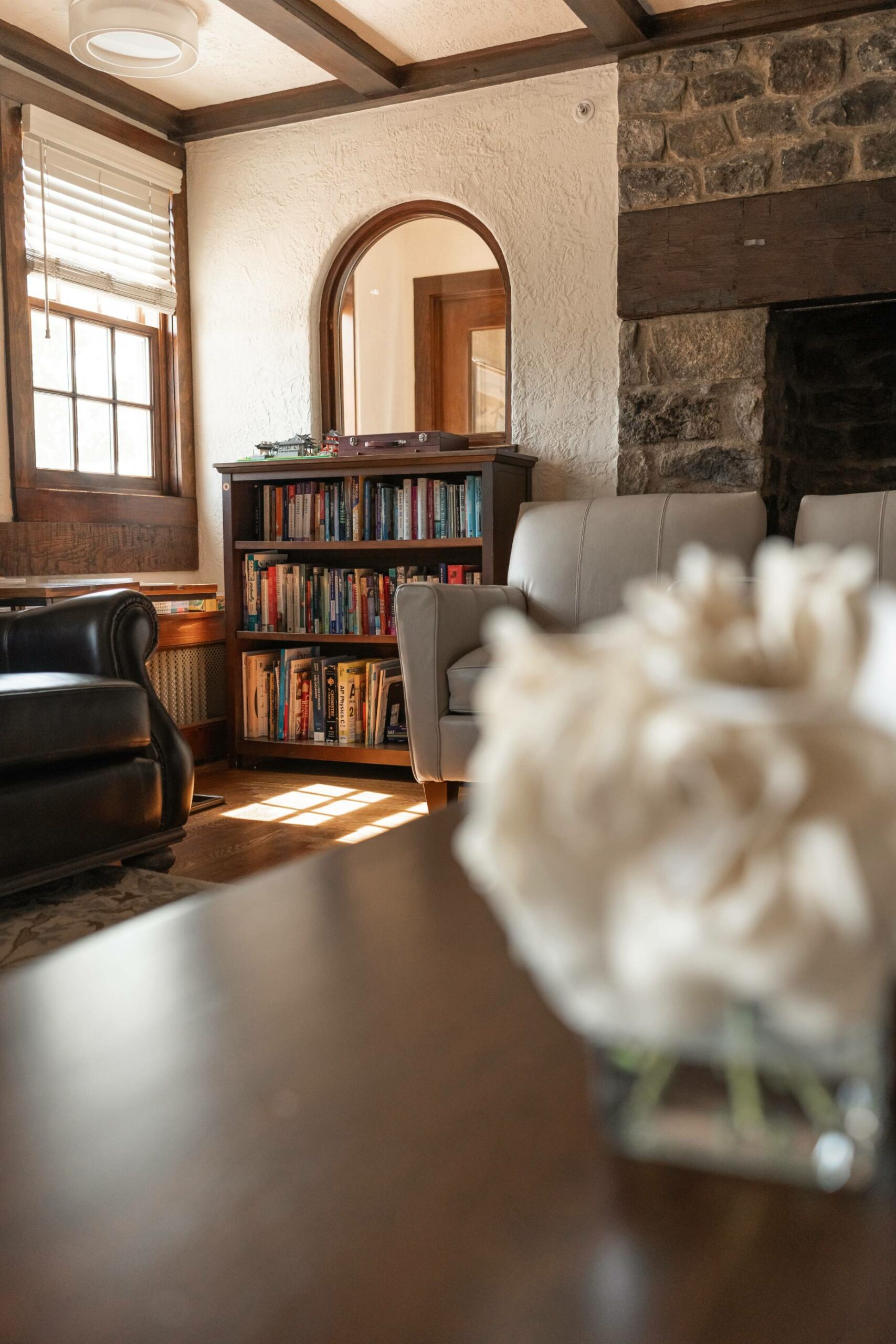bookshelf in a shared living space | hiddenriverhealing.com