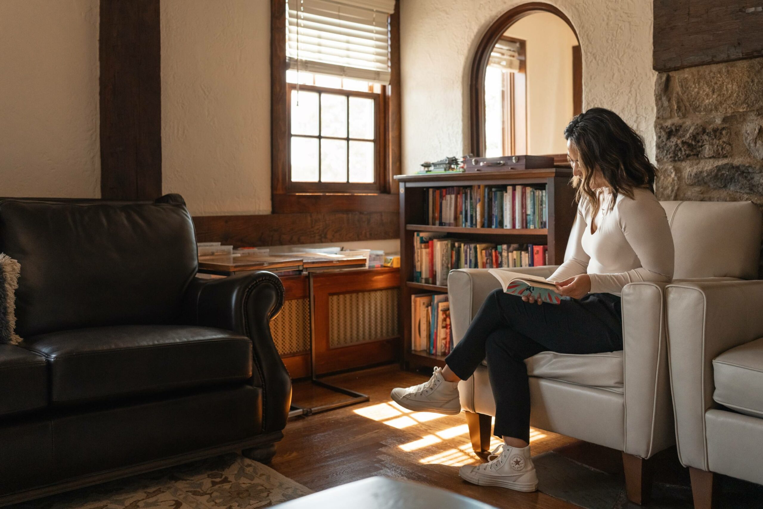 young woman reading a book | Hidden River residential eating disorder treatment center